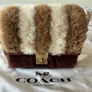 COACH Hutton 18 shearling shoulder bag.